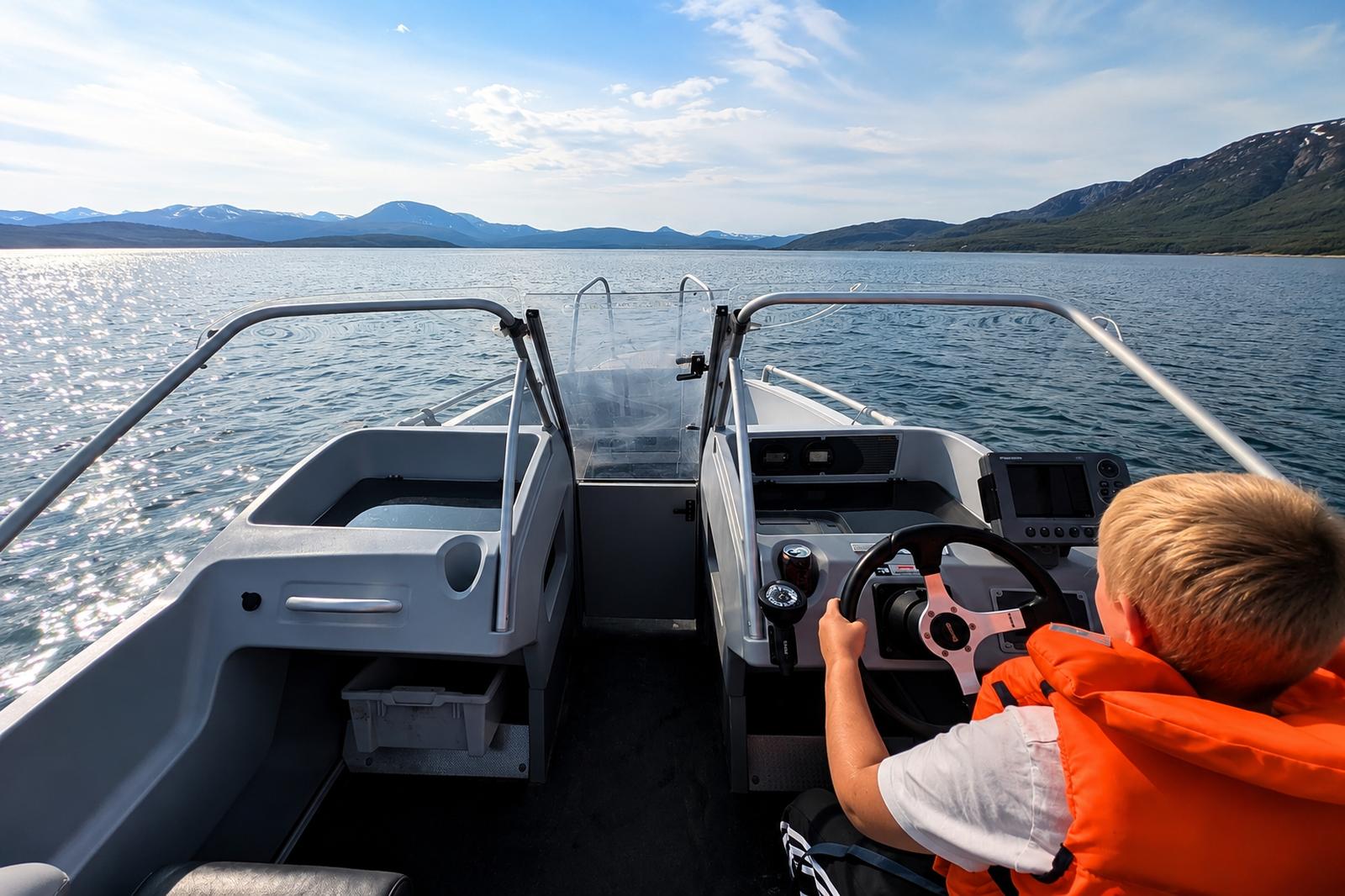 kid driving boat in sunny weather